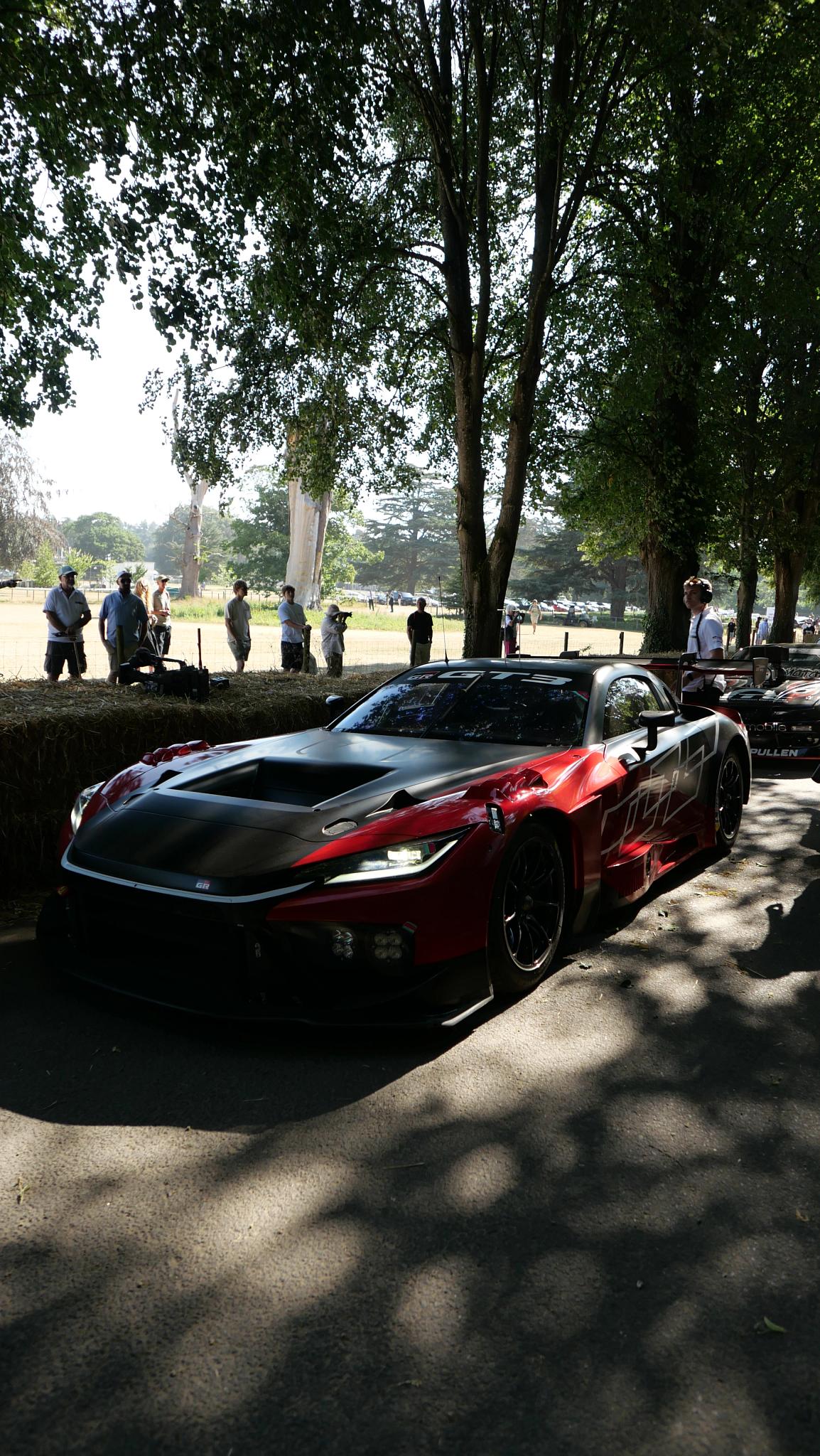 car, street, vehicle, road, race, motor vehicle, transportation system, ferrari, action, people, automotive, wheel, tree, pavement, hurry
