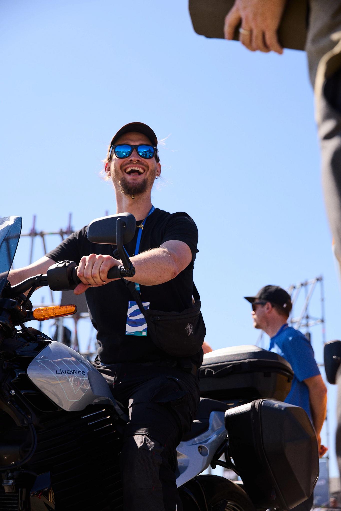 pulse, news, events, reload land 2026, berlin, honcho events, bike, man, race, grand prix, seated, track, people, sunglasses, adult, north america, competition, woman