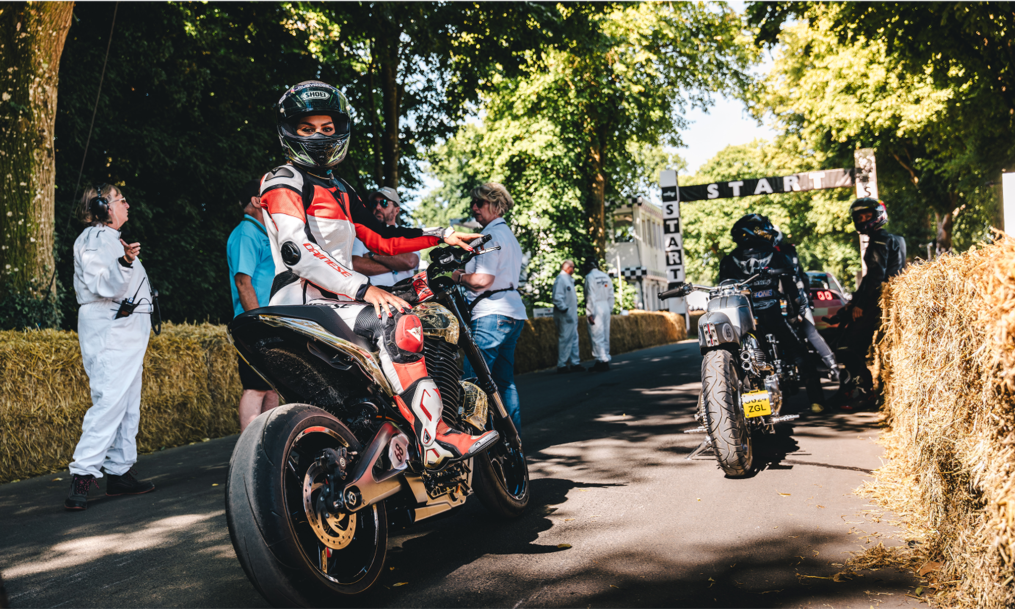 news, articles, cms, s2 alpinista, festival of speed, fos, goodwood, bike, vehicle, people, biker, road, seated, man, wheel, transportation system, motorbike, group together, rider, street, race, helmet, group, roll along, action, drive, competition, hurry, adult, driver