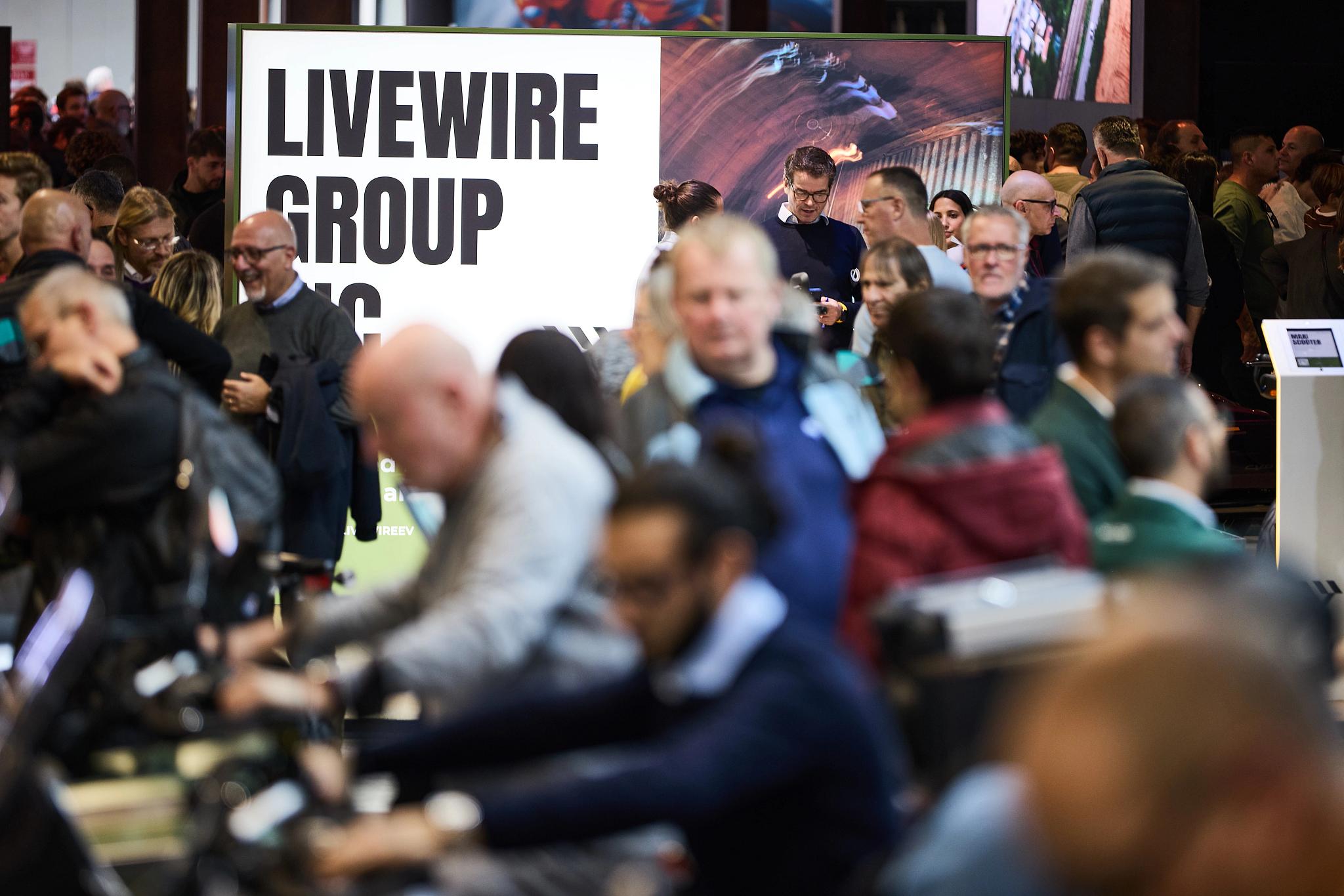 pulse, news articles, eicma, 2025, stacyc 10 year, s2 alpinista corsa, s4 honcho, alpinista patrol, maxi scooter, many, people, group, adult, man, crowd, woman, election