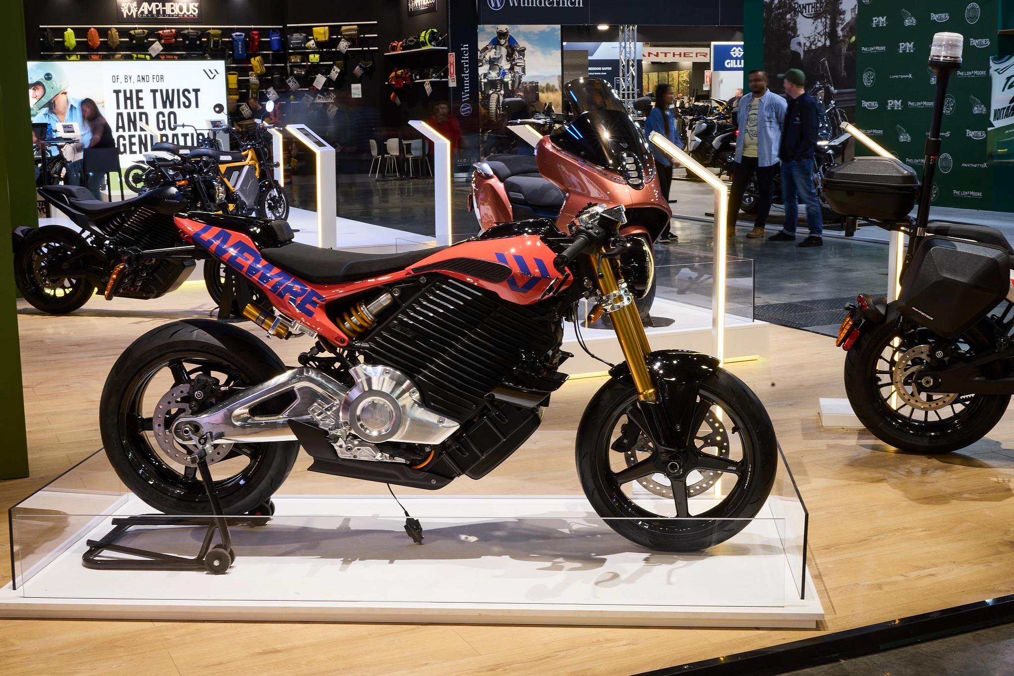 pulse, news articles, eicma, 2025, stacyc 10 year, s2 alpinista corsa, s4 honcho, alpinista patrol, maxi scooter, bike, motorbike, suzuki, vehicle, race, drive, biker, public show, ride, street, fast, wheel, transportation system, machine, motocross, rider, hurry, exhibition, people, competition, engine, helicopter, exhibit, motorcyclist, seated, road, track