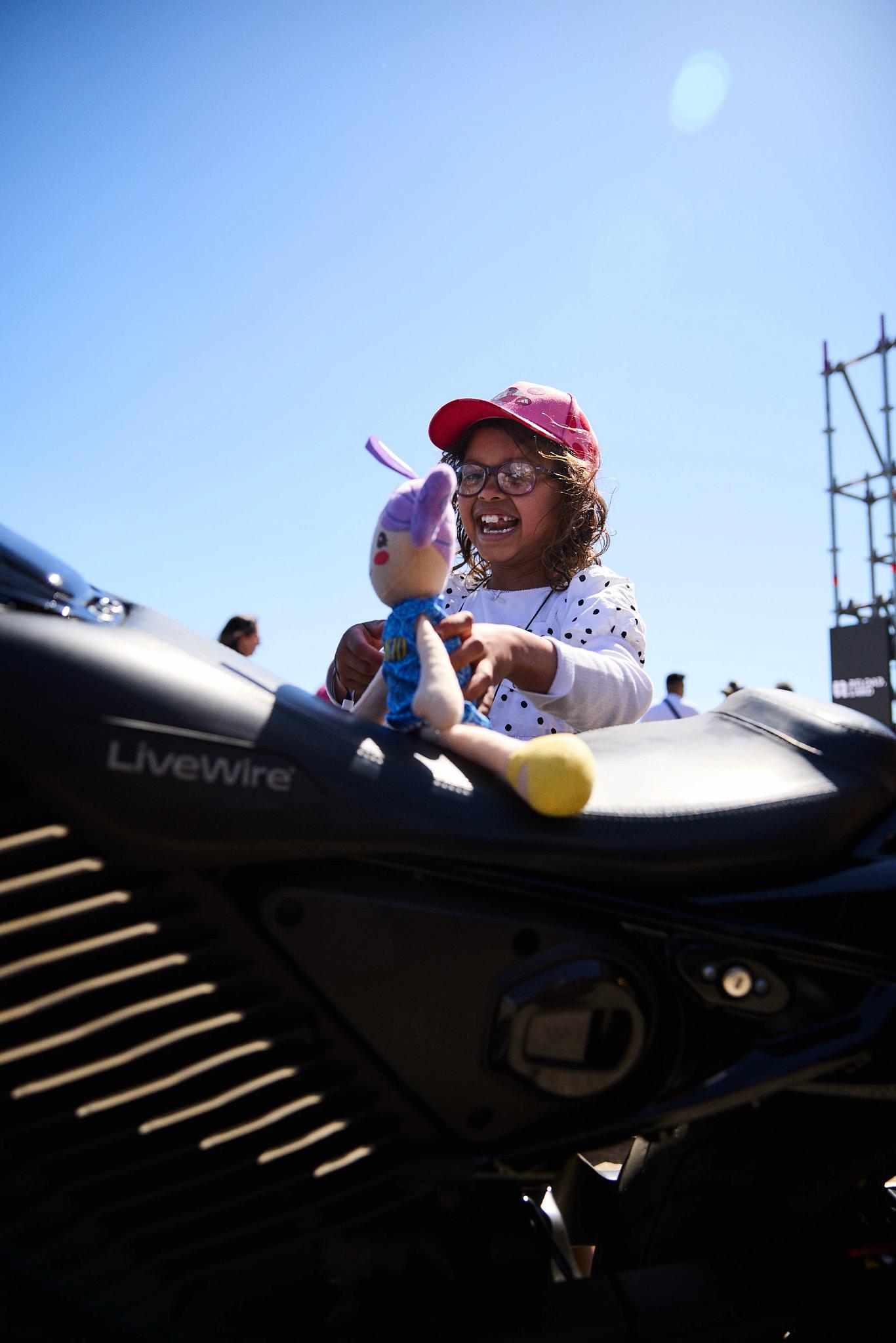 pulse, news, events, reload land 2026, berlin, honcho events, vehicle, motor vehicle, travel, woman, people, seated, adult, fun, car, north america, girl, outdoors, portrait, recreation, transportation system, love, bike