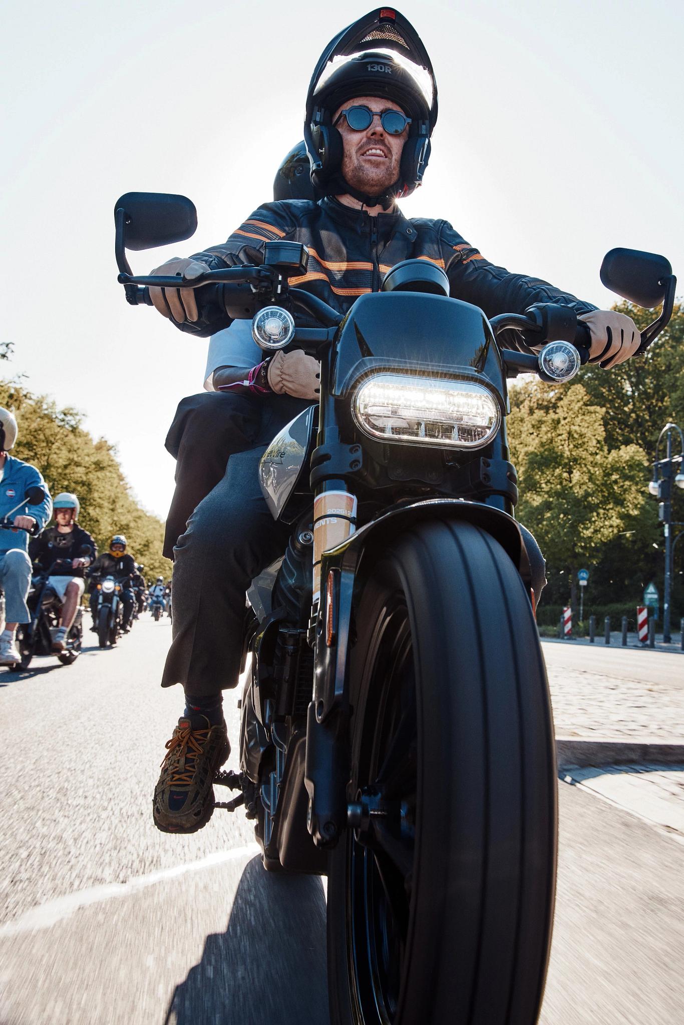 pulse, news, events, reload land 2026, berlin, honcho events, bike, biker, seated, people, vehicle, motorbike, rider, man, crash helmet, helmet, race, street, wheel, motor vehicle, competition, road, transportation system, ride, hurry