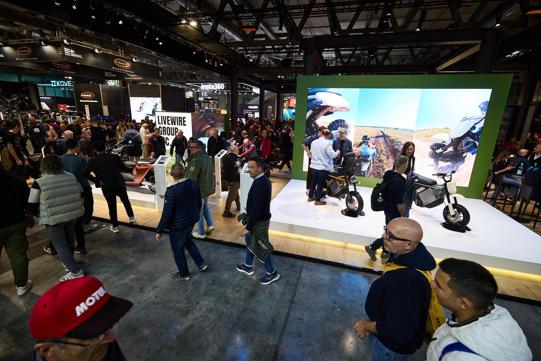 pulse, news articles, eicma, 2025, stacyc 10 year, s2 alpinista corsa, s4 honcho, alpinista patrol, maxi scooter, competition, people, exhibition, many, sports fan, track, soccer