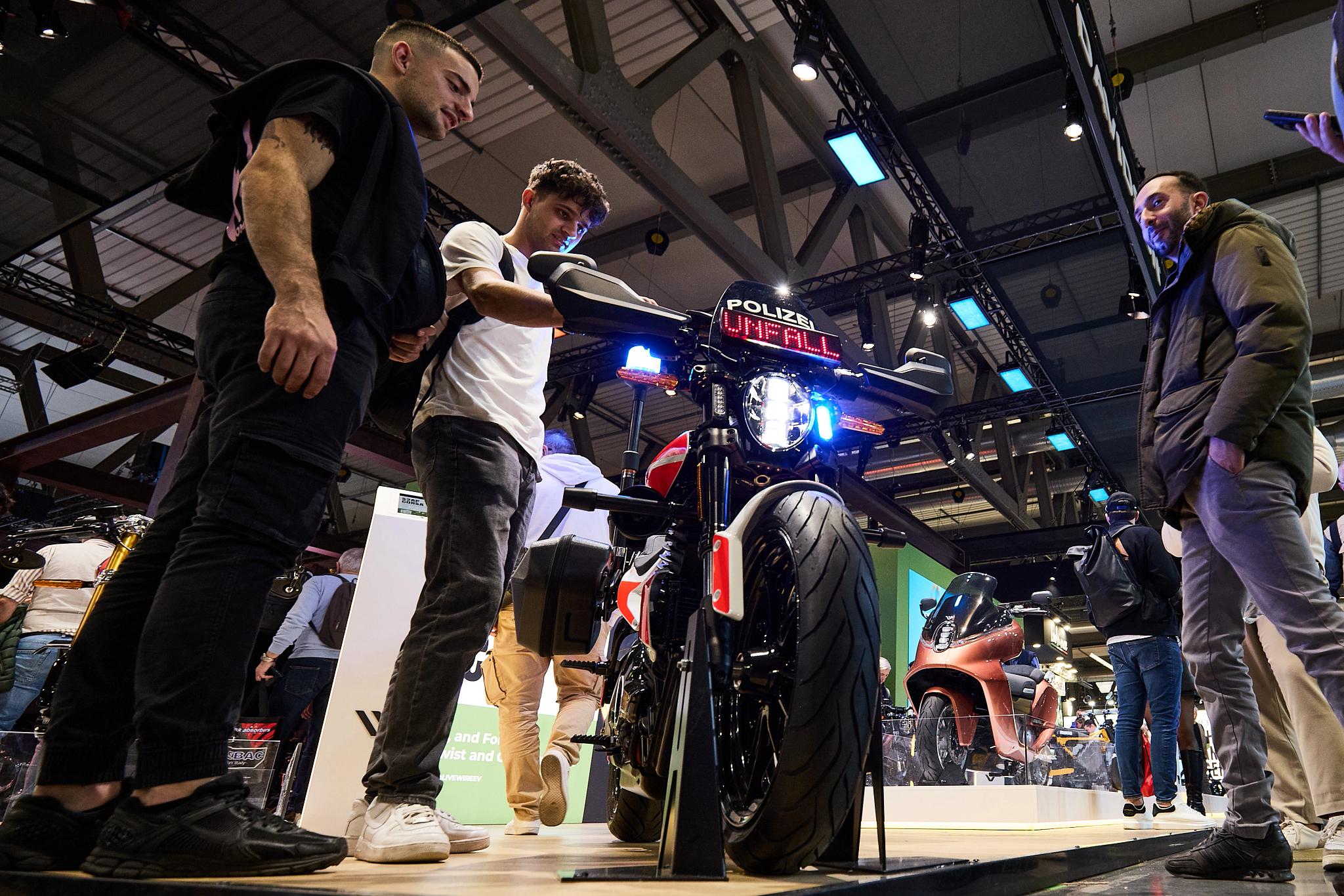 pulse, news articles, eicma, 2025, stacyc 10 year, s2 alpinista corsa, s4 honcho, alpinista patrol, maxi scooter, street, people, track, public show, performance, competition, bike, festival, band, man, garage