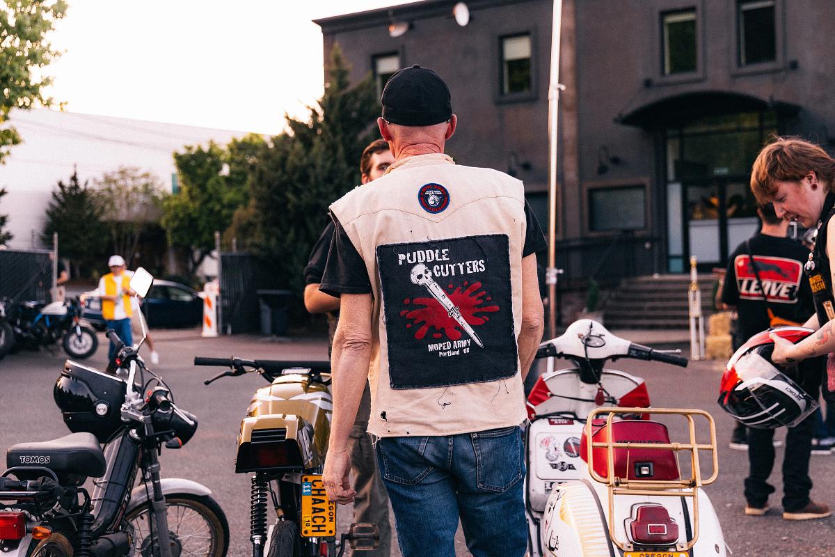 pulse, news, one show, put'rthr, honcho, party, events, 2026, portland, oregon, street, bike, people, city, vehicle, road, urban, police, race, biker, seated, wheel, man, north america, motor vehicle, cyclist, woman