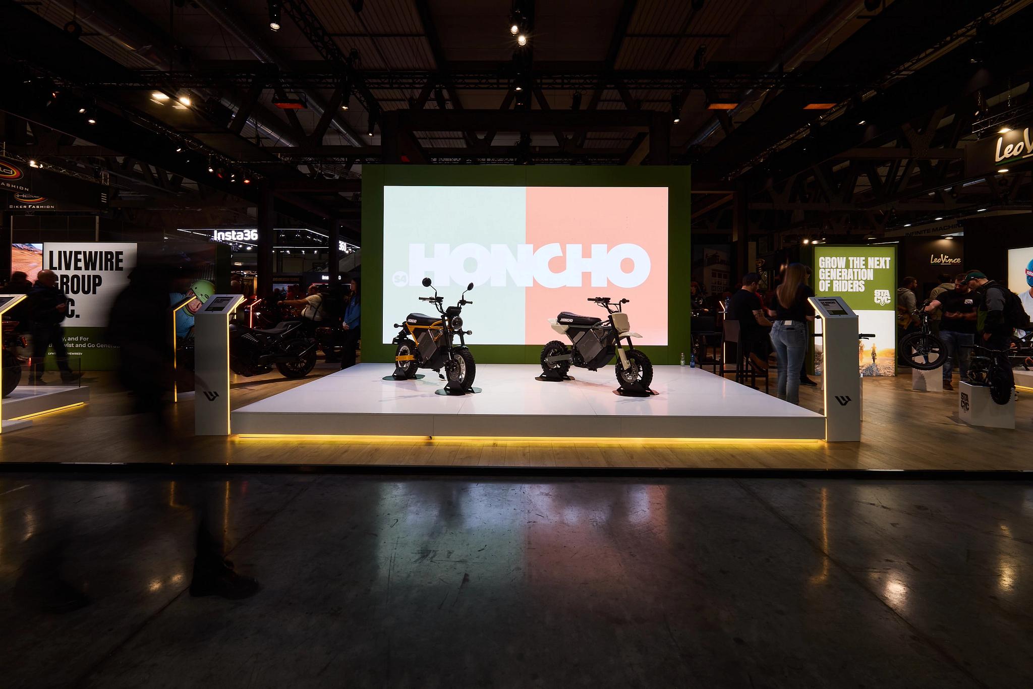 pulse, news articles, eicma, 2025, stacyc 10 year, s2 alpinista corsa, s4 honcho, alpinista patrol, maxi scooter, airport, track, auto racing, race, indoors, people, championship, airplane, competition, transportation system, subway system, action, industry